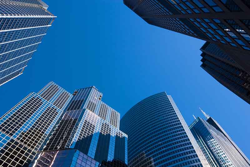 Skyscrapers against a blue sky.