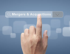 Hand pushing Mergers & Acquisitions (M&A) on a screen.